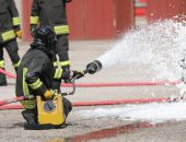 Firefighrer spraying AFFF foam