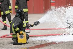 Firefighrer spraying AFFF foam