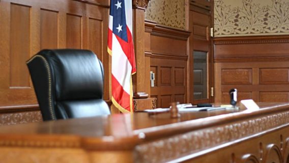 U.S. courtroom with flag