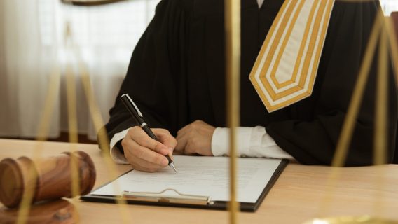 Judge signing document