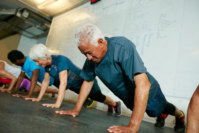 older man doing a push up